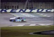  ?? KAREEM ELGAZZAR — THE CINCINNATI ENQUIRER VIA AP ?? Martin Truex Jr. (78) crosses the finish line to win the NASCAR Cup Series auto race Saturday at Kentucky Speedway in Sparta, Ky.