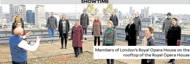  ??  ?? Members of London’s Royal Opera House on the rooftop of the Royal Opera House