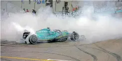  ?? | AFP ?? SEBASTIAN Vettel says goodbye to F1 with a few doughnuts at the Yas Marina circuit.