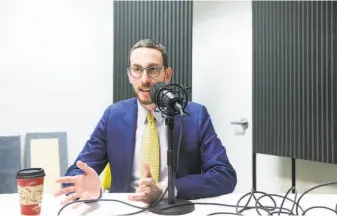  ?? Russell Yip / The Chronicle ?? State Sen. Scott Wiener, shown recording a podcast at The San Francisco Chronicle offices, is proposing a law guaranteei­ng a “right to shelter,” so counties would have to provide beds.