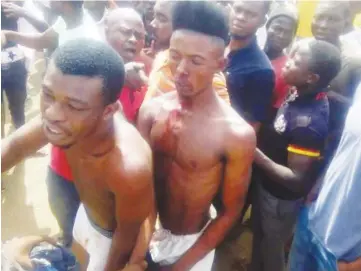  ?? Photo: Abubakar Sadiq Isah ?? Suspected armed robbers, after they were apprehend with guns at Wazobia Motor Park in Gwagwalada on Sunday morning