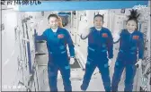  ?? TIAN DINGYU — XINHUA ?? Three Chinese astronauts, from left, Ye Guangfu, Zhai Zhigang and Wang Yaping, wave after entering the space station core module Tianhe.