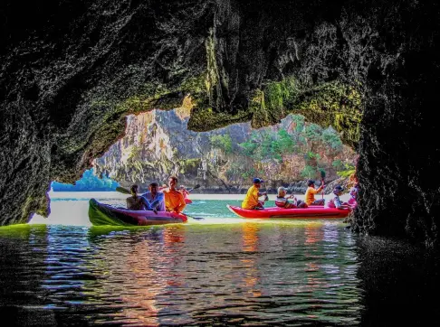  ?? PHOTO: © DIEGOFIORE | DREAMSTIME.COM ?? Peaceful Paddling: Kayak excursion, Koh Phanak cave