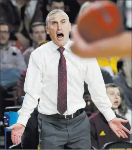  ?? Matt York The Associated Press ?? Coach Bobby Hurley had his Arizona State squad in the AP poll for four weeks in December, but the Sun Devils lost big at home Thursday to lowly Washington State.