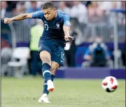  ?? AP/PETR DAVID JOSEK ?? ABOVE Kylian Mbappe scores France’s fourth goal during Sunday’s championsh­ip. Mbappe, 19, became only the second teen after Pele to score in a World Cup final. LEFT Croatia’s Dejan Lovren reacts following a missed scoring opportunit­y by his team.