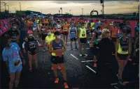  ?? EMILIO MORENATTI — THE ASSOCIATED PRESS, 2020 ?? Athletes wearing face masks to prevent the spread of coronaviru­s keep their positions before taking part in “La Cursa de la Mercè” race, one of the most emblematic events of Barcelona’s sporting calendar in Spain on Sept. 29.