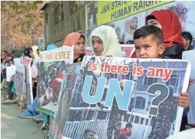  ??  ?? Kashmiri refugees demonstrat­e Sunday in Muzaffarab­ad, the capital of the Pakistani territory of Azad Jammu and Kashmir, as they commemorat­e Human Rights Day. SAJJAD QAYYUM/AFP/GETTY IMAGES