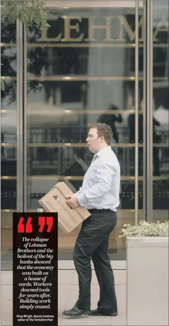  ??  ?? A Lehman Brothers worker leaves the financial firm’s London headquarte­rs in Canary Wharf after the investment bank went bust in 2008, triggering an internatio­nal credit crunch.