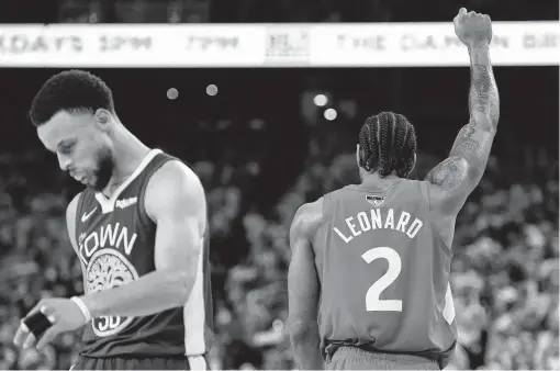  ?? Frank Gunn / Associated Press ?? The NBA’s passing of the torch may be at hand with Warriors star Stephen Curry, left, exiting a loser as the Raptors’ Kawhi Leonard celebrates a title.