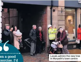  ??  ?? Locals admire the new tree in Morpeth’s town centre