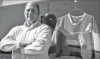  ?? CODY MCEACHERN - TRURO DAILY NEWS ?? Kelly Kolke played four seasons with the Humboldt Broncos, from 1982 to 86. Following the recent tragic accident that claimed the lives a number of team members, Kolke dug out his old jerseys and now displays them in the window of the Grant Thornton...