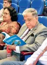  ?? ?? The Director General of Health Services, Dr. Asela Gunawarden­a looks through the National Guidelines