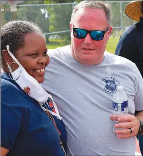  ?? Release. ?? Connye Brooks-Smith (left) stands Oct. 2 with Opelika Police Chief Shane Healey at the balloon