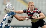  ?? GETTY IMAGES ?? Grace Brooker puts on a fend against Auckland’s Princess Elliot during the 2021 Farah Palmer Cup. A longterm injury kept her out of the World Cup.