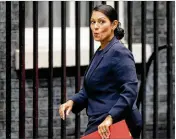  ?? ALASTAIR GRANT / ASSOCIATED PRESS ?? Priti Patel, then Britain’s secretary of state for internatio­nal developmen­t, reacts to a media question last month as she arrived for a Cabinet meeting at 10 Downing Street in London.