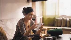  ?? Michael Simmonds / Sony Pictures Classics ?? Ila (Nimrat Kaur), who desires to revive the passion between her and her husband, makes a new friend through a delivery system error in “The Lunchbox.”