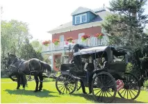  ?? GREEN WOODS INN ?? A wedding party arrives by horse-drawn carriage at the historic Green Woods Inn.