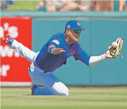  ?? | AP ?? Cubs center fielder Albert Almora Jr. has a stiff neck after trying to make a diving catch in the third inning Friday.