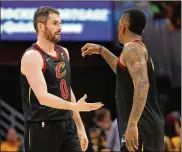  ?? GREGORY SHAMUS / GETTY IMAGES ?? Kevin Love (0), celebratin­g with JR Smith in the playoffs, has averaged 17.1 points and 10.0 rebounds since being acquired from Minnesota.