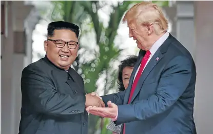  ?? / KEVIN LIM/ THE STRAITS TIMES VIA REUTERS ?? US President Donald Trump meets North Korean leader Kim Jong-un at the Capella Hotel on Sentosa island in Singapore.