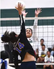  ?? RECORDER PHOTO BY CHIEKO HARA ?? Lindsay High School's Briana Hernandez, right, attempts to block Corcoran High School's spike Wednesday during the first set at Lindsay.