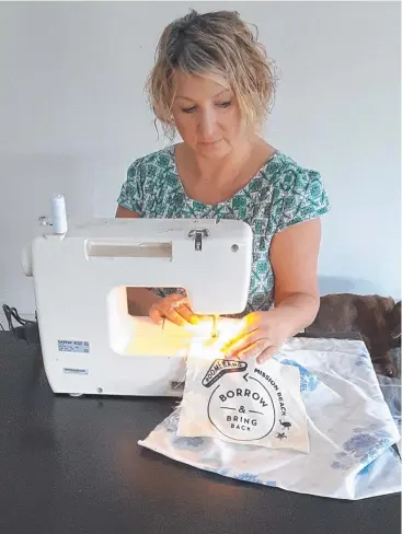  ?? PICTURE: SUPPLIED ?? UNIQUE LOGO: Dee Dean, the Plastic Free Mission Beach Boomerang Bags co-ordinator, sews some of the boomerang bags with a logo of a turtle and a cassowary.