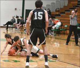  ?? PILOT PHOTO/MAGGIE NIXON ?? It’s a scrum for the loose ball as Culver’s Owen Clingler and Zach Czarnecki of Bremen battle for control while Braxton Conley looks on.