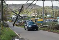  ?? JIM WYSS MIAMI HERALD ?? Left: Puerto Rico was hit hard by Hurricane Maria. The Senate approved a $36.5 billion disaster aid bill on Tuesday.