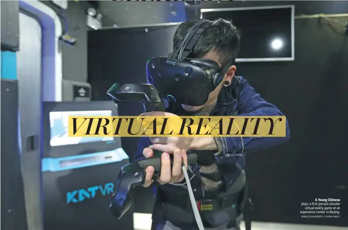  ?? WANG ZHUANGFEI / CHINA DAILY ?? A Young Chinese plays a first-person shooter virtual reality game at an experience center in Beijing.