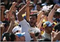  ?? AP/ARIANA CUBILLOS ?? Supporters of Venezuela’s self-proclaimed interim President Juan Guaido demonstrat­e Tuesday against the government of President Nicolas Maduro in Caracas, Venezuela.