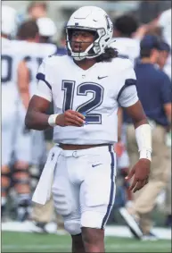  ?? Edward Diller / Getty Images ?? UConn QB Tyler Phommachan­h takes the field against Army on Saturday at Michie Stadium in West Point, N.Y.