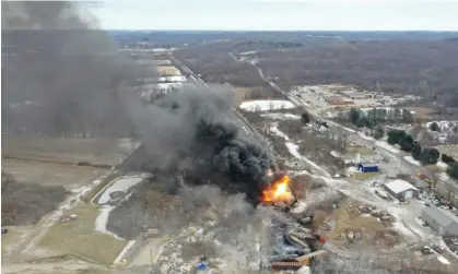  ?? ?? Portions of a freight train that derailed on 3 February 2023, in East Palestine, Ohio, still onfire at mid-day on 4 February 2023. Photograph: Gene J Puskar/AP