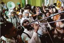  ?? Silvia Izquierdo/Associated Press ?? Musicians play during Friday’s ceremony, marking the official start of Carnival, what one reveler called “everyone’s passion.”