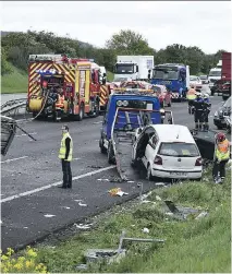  ?? ERIC FEFERBERG/AFP ?? French rescue workers and police officers attend the site of a 2016 road accident involving eight vehicles. With a little imaginatio­n, the details of this case could be reworked into something that gets explored during France’s annual #nuitdudroi­t.