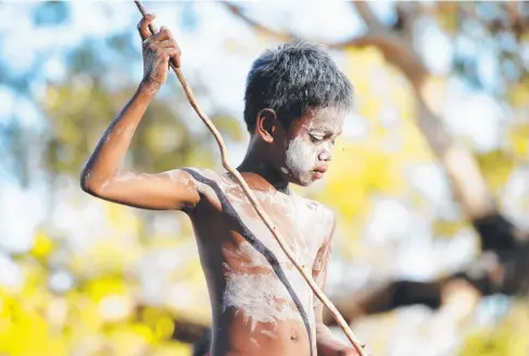  ?? LOST CULTURE: Young children from around Jabiru in Kakadu National Park are taught traditiona­l singing and dancing by indigenous elders. ??