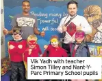  ??  ?? Vik Yadh with teacher Simon Tilley and Nant-YParc Primary School pupils