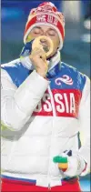  ?? AP PHOTO ?? In this Sunday, Feb. 23, 2014, file photo, Russia’s gold winner Alexander Legkov kisses his medal during the medals ceremony for the men’s 50-kilometre cross-country race during the closing ceremony of the 2014 Winter Olympics in Sochi, Russia.