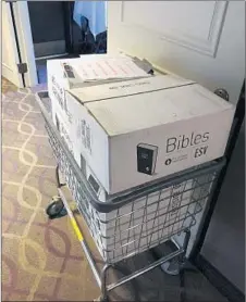  ?? TOMMY DANIELSEN/AP ?? Boxes of Bibles sit in a cart at Sheraton Rockville Hotel in Rockville, Md.