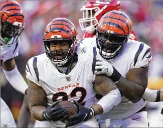  ?? ED ZURGA / ASSOCIATED PRESS ?? Cincinnati Bengals defensive end B.J. Hill (92) celebrates in January after intercepti­ng a pass in the AFC championsh­ip game against the Chiefs in Kansas City, Mo.