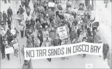  ?? Gregory Rec/portland Press Herald ?? Protesters march in Portland, Maine, on Saturday to attend a rally opposing oilsands pipeline plans for the region.