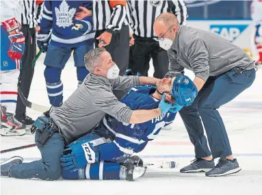  ?? CLAUS ANDERSEN GETTY IMAGES ?? Leafs captain John Tavares is out of the NHL playoffs indefinite­ly with a concussion. We break down what happened, S3