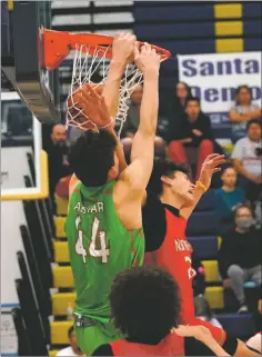  ?? MARTY SAIZ/Facebook ?? Jose Murillo posterizes Isaiah Carr on Saturday (March 19).