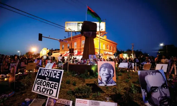  ?? ?? A memorial to George Floyd in Minneapoli­s. Photograph: Nicholas Pfosi/Reuters