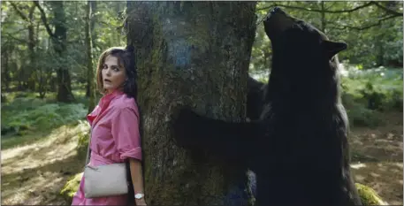  ?? PAT REDMOND — UNIVERSAL PICTURES VIA AP ?? This image released by Universal Pictures shows Keri Russell in a scene from “Cocaine Bear,” directed by Elizabeth Banks.