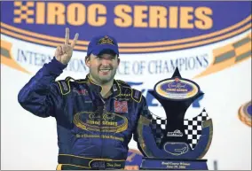  ?? AP-Paul Kizzle, File ?? Tony Stewart poses with the trophy after winning the Crown Royal IROC auto race in Daytona Beach, Fla., on June 26, 2006. The IROC Series, where the best drivers from various discipline­s raced each other in equally prepared cars, ran for 30 seasons before Tony Stewart won its final championsh­ip in 2006 and the series quietly went away. Now Stewart, along with fellow NASCAR Hall of Famer Ray Evernham, has teamed with a group of heavyweigh­ts to bring an all-star circuit back in 2021.