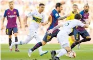  ?? FOTOGRAFO ?? Messi eludiendo defensores xeneizes con facilidad.