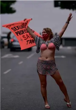  ??  ?? ABOVE: Sex workers in Belo Horizante, Brazil, have gone on strike, demanding they be included in the frontline workers category for vaccinatio­n.