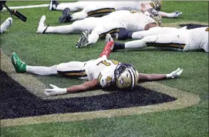  ?? Butch Dill / Associated Press ?? Saints running back Alvin Kamara celebrates his sixth touchdown of the game, tying the NFL record for most rushing touchdowns in a game, in the second half against the Minnesota Vikings in New Orleans on Friday.