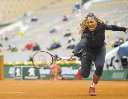  ??  ?? Serena Williams of the US returns the ball to Kristie Ahn of the US during their women’s singles firstround tennis match at the Philippe Chatrier court on day two of the French Open tennis tournament, on Monday.