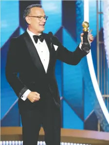  ?? PAUL DRINKWATER/NBC UNIVERSAL ?? “Showing up on time is one of the greatest liberating acts you can give yourself in a movie,” said a teary Tom Hanks while accepting the Cecil B. demille Award.